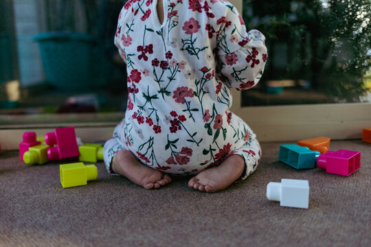 Baby playing with colorful blocks