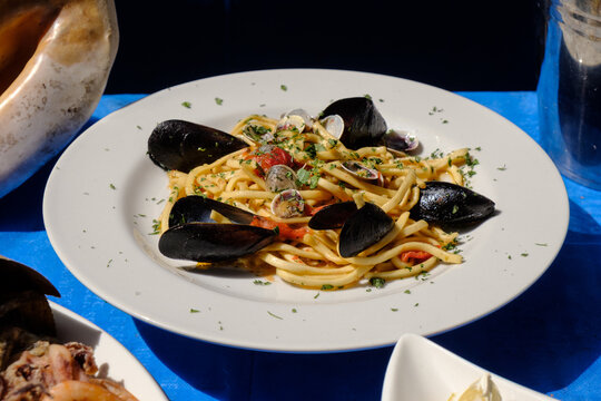 Spaghetti with clams and mussels Neapolitan style - Seafood specialties of traditional Neapolitan cuisine