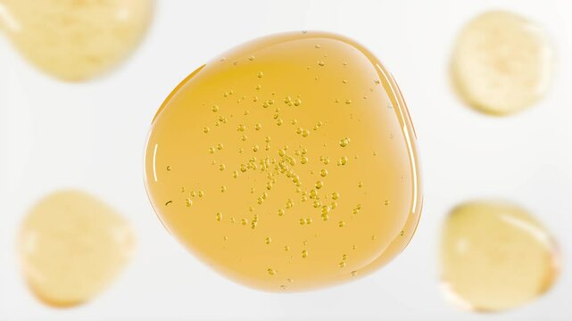 3D golden gel texture with air bubbles on a white background, skin care serum or cosmetics essence. Beauty, wellness, or spa-themed content. Natural cooking oil, motor oil. 