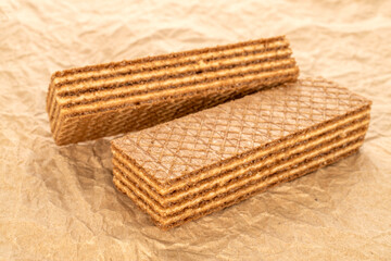 Two sweet waffles, macro, on kraft paper.