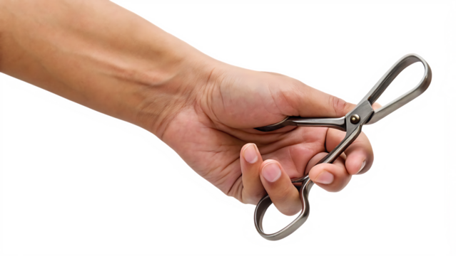 Hand holding small metal scissors isolated on a white background