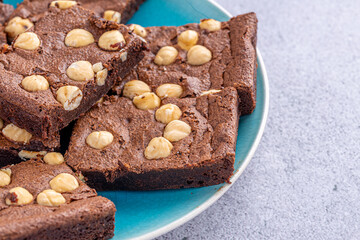 Homemade chocolate brownie photography . Top view on rustic background.Rich chocolate brownie , showcasing its dense texture and glossy surface, professional food photography.