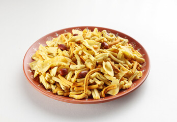 Indian popular snacks called Farsan or Mixture serve in plate isolated on white background,