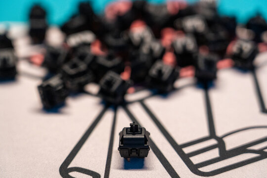 Focused mechanical keyboard switch on custom desk mat