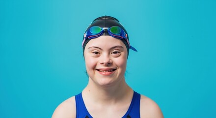 Smiling girl with down syndrome wearing blue swimming cap and goggles on turquoise background. Child with special needs ready for aquatic activity. Inclusion and adaptive sports. equipment sale