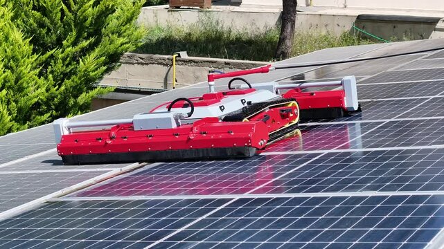 Robot cleans solar panels - 4k drone footage of robot cleaning solar panels