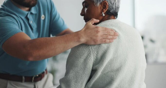 Physiotherapist, hands or senior woman with back pain, massage or injury recovery. Patient, consultation or chiropractor for physical therapy, medical rehabilitation or help for body health in clinic