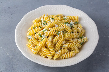 Cheese fusilli pasta in a plate. Turkish name; Peynirli makarna burgu