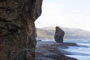 Rocks on the beach by the ocean on the island. Beautiful natural landscape