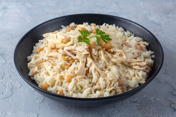 Traditional delicious Turkish food; Rice with chickpeas and chicken (Turkish name; Tavuklu nohutlu pilav or pilaf)