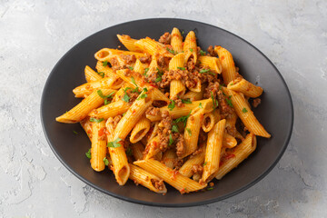 Penne pasta with minced meat looks delicious