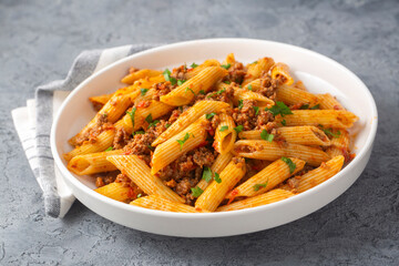 Penne pasta with minced meat looks delicious
