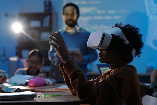 Child Wearing VR Headset in Modern Classroom Setting