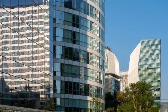Office buildings with blue-tinted glass facades, reflections of surrounding architecture, Polanco, Ciudad de M&eacute;xico, urban skyline, corporate atmosphere