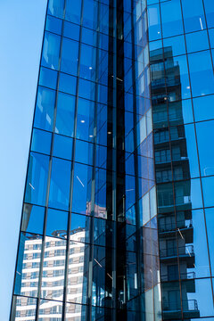 Close-up of glass facade reflecting modern architecture, Polanco, Ciudad de M&eacute;xico, geometric patterns, sunlight, and shadows, corporate city design