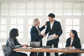 Successful business contract dealing with young smart businessman entrepreneur and senior manager...