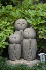 Serene Stone Jizo Statues Peaceful Garden Sculpture Trio