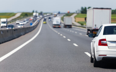 Cars and trucks driving on busy highway