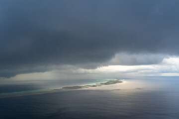 Aerial view of Rangiroa Atoll under a stormy sky, Tuamotus, French Polynesia