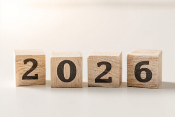 Wooden cubes displaying 2026 herald change and rebirth, evoking Hogmanay celebrations and ancient solstice rituals