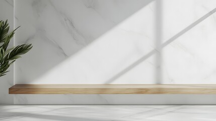Empty wooden shelf against a white marble wall with plant.