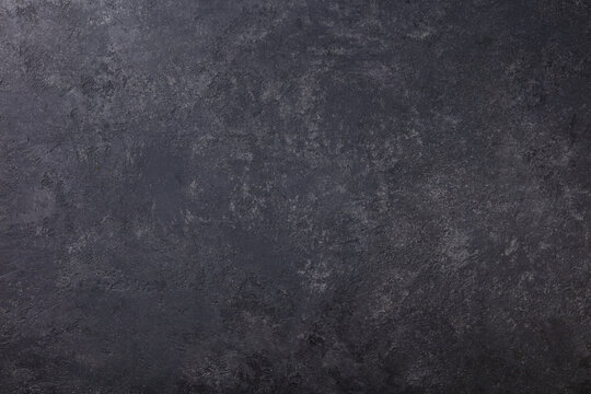 Natural black slate stone background pattern with high resolution. Top view. Copy space.