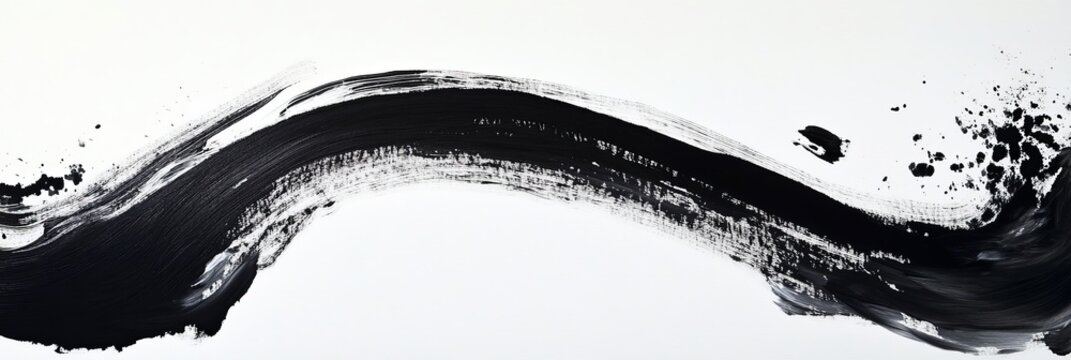 Abstract black ink stroke on white background creating a dynamic wavy shape.