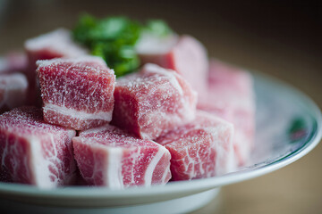 Frozen marbled pork cubes, icy elegance for Winter Solstice delicacies, culinary artistry, and celebration of Kan-po, invoking cozy abundance