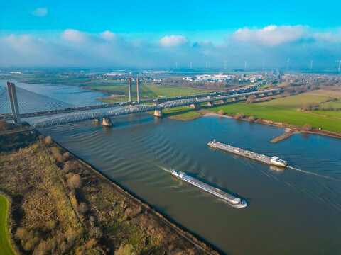 Dutch Martinus Nijhoffbrug bridge crossing the Waal river. High-standard infrastructure of the Netherlands, a combination of old and new constructions