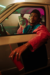 Stylish retro couple in car.