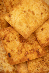 Nacho chips texture. Tortilla chips. Taco chips. Close-up. Food background. Tasty snack. Group of crispy corn chips isolated on white background.
