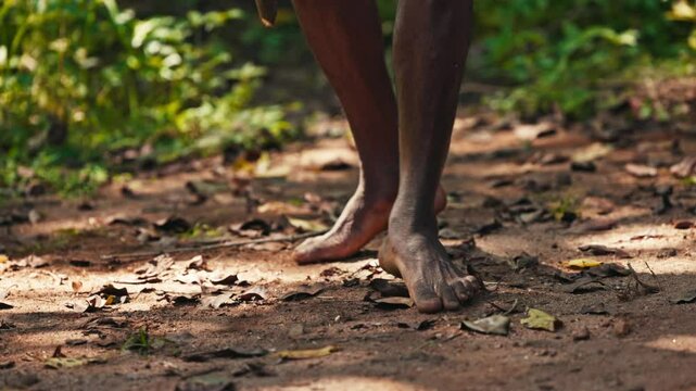 Vedda tribesman of Sri Lanka dancing a ritual dance before hunting, traditional lifestyle, and connection to nature. Tribal portrait in native Habitat 120 fps slow motion. 02.03.2022 SRI LANKA