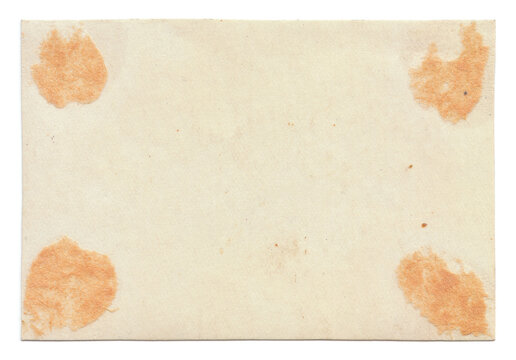 Vintage background of old ancient torn paper texture with spots. Old paper as background. Interesting texture of old yellowed paper slightly damaged by mold. Unique vintage texture of old paper.
