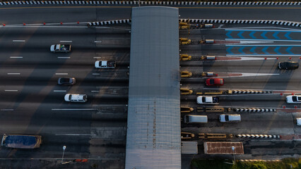A highway where cars are paying tolls.