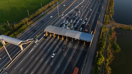 A highway where cars are paying tolls.