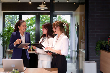 Asian Women Business Meeting Collaboration in Modern Office Space Teamwork and Communication Technology Asian Businesswomen Discuss Ideas Asian Female Professionals