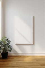 Interior of a bright living room with a blank canvas and Monstera plant at daytime