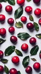 Bright red cranberries stand out against a clean white background, reflecting light with their glossy surface. The shiny berries are surrounded by green leaves, highlighting their freshness
