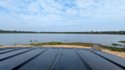 Scenic landscape view from truck during wildlife safari overlooking lake in Wilpattu National Park Sri Lanka © Travelanza