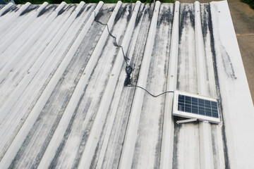 Small solar panels installed on a metal sheet roof