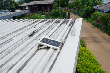 Small solar panels installed on a metal sheet roof