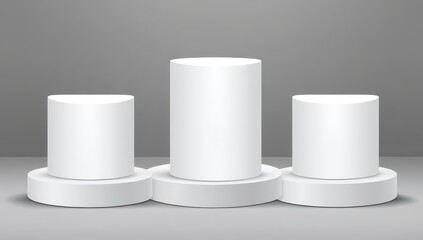 Three white cylindrical podiums, in a gray backdrop