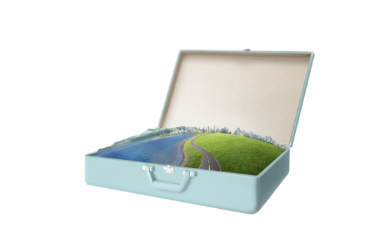 Open suitcase showing miniature world with road leading to city on transparent background