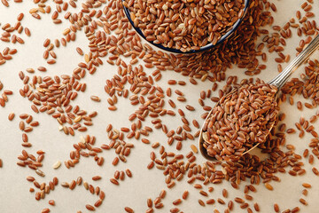 Nourishing organic brown rice scattered elegantly on a rustic surface