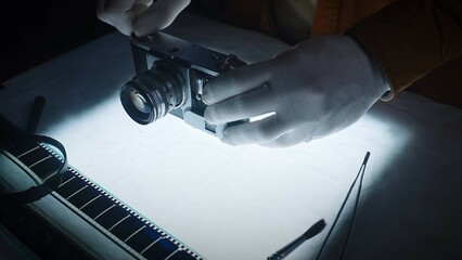 Professional Film Camera Restoration Process with Gloves and Tools