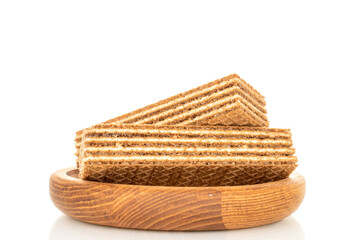 Sweet waffles on a wooden saucer, close-up, isolated on a white background.