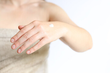 Hand cream. Close-up of young woman's hand with moisturizing cream. Skin care. Close-up of female hands applying cream to skin. Healthy skin, skin care concept. Cosmetology. Daily routine