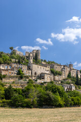 Fototapeta premium Montbrun les Bains medieval village rising on a hill in Drome, France