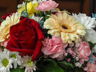 colorful different types of flowers in a bouquet, daisy, carnation, dahlia, rose, gypsophila,...