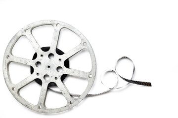 Obraz premium Old 35mm motion picture film reel on white background. Cinema concept